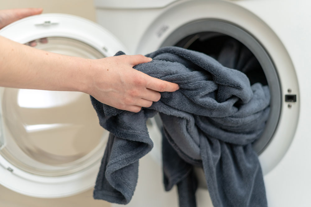 person-removing-dry-laundry