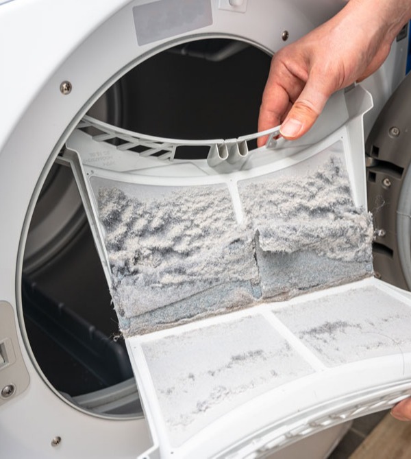 person-removing-lint-from-dryer